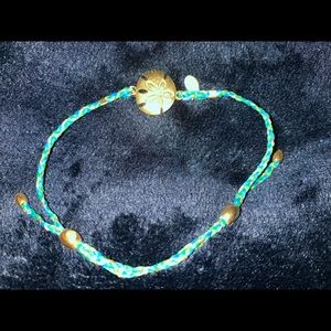 Alex and Ani sand dollar string bracelet.